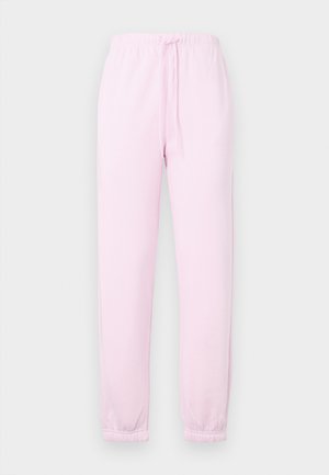 Lyserøde joggebukser med elastisk talje, snor og elastiske mansjetter, vist mot en ensfarget lys bakgrunn.