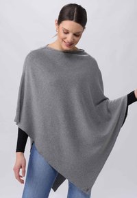 Hallide pehmeast kangast hall poncho, millel on drapeeritud disain, lai kaelus ja ebatasane kuju, mille lisavad nupud.
