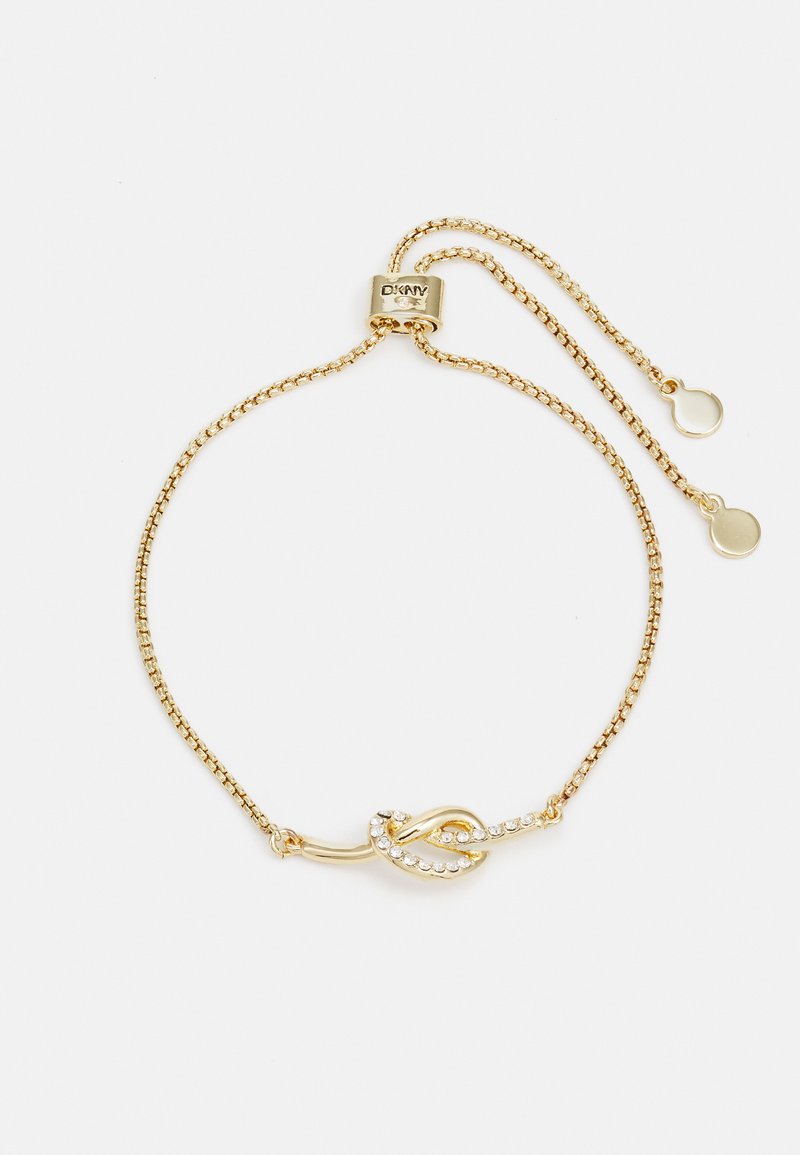 Χρυσό βραχιόλι με λεπτή αλυσίδα, διακοσμημένο με σχέδιο κόμπου που έχει κρυστάλλινες πέτρες και ρυθμιζόμενο κλείσιμο με σύρσιμο.