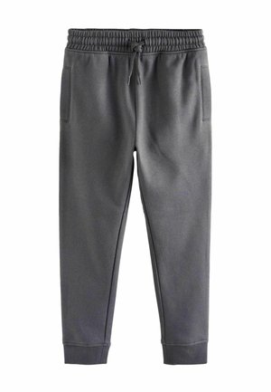 Mørkegrå joggingbukser med elastik i taljen, snøre, sidelommer og afsluttede ankler, lagt fladt på hvid baggrund.
