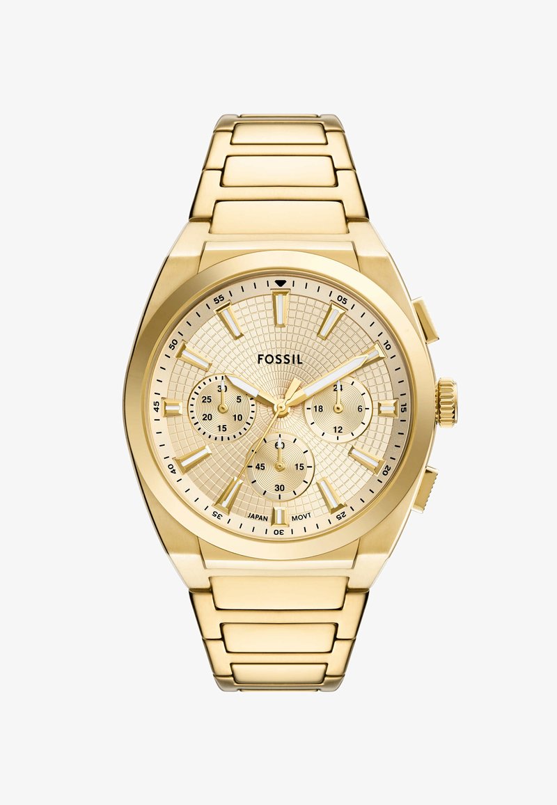 Montre en acier inoxydable doré avec un cadran texturé doré, trois sous-cadrans et des index pour les heures. Présente un bracelet à maillons et un fermoir à bouton poussoir.