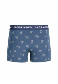 Boxer bleu avec motifs cachemire blancs et une ceinture élastique marine portant la marque "JACK & JONES" en lettres blanches.