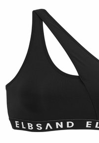 Crni sportski grudnjak od glatkog materijala, s dizajnom racerback i širokom elastičnom trakom na kojoj je u bijelom napisan tekst "ELBSAND".