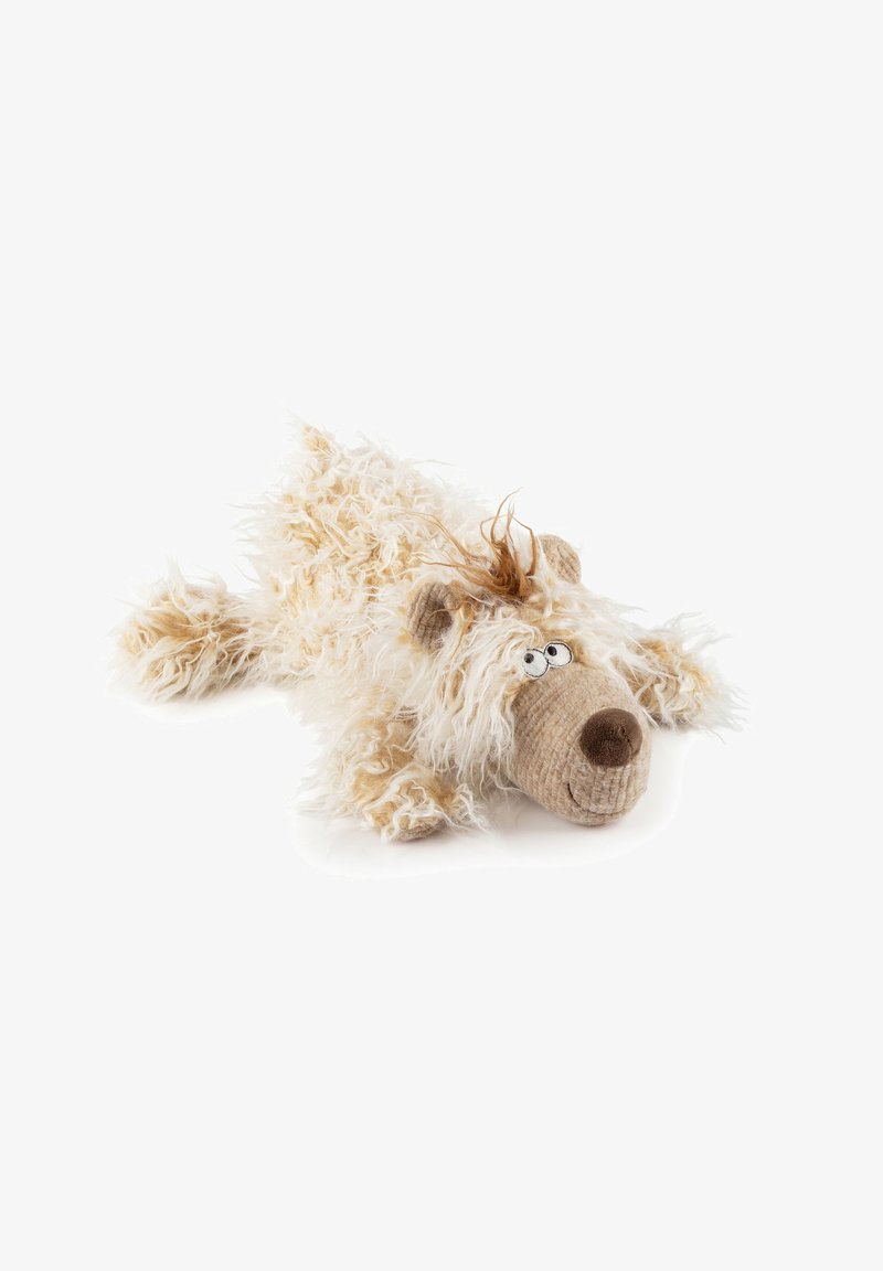 Plush toy dog with curly cream fur, floppy body, brown nose, embroidered eyes, and tuft of brown hair on its head, lying down.