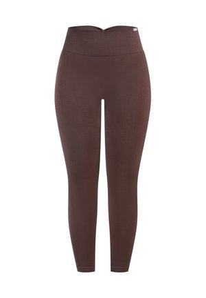 Bruine legging met hoge taille, gladde textuur en aangesloten ontwerp. Voorzien van subtiele lijnpatronen langs de benen. Zachte stoffen materiaal.