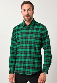 Camisa de cuadros verde y negra de botón, en tejido de algodón, con cuello, mangas largas y botones negros, con un dobladillo curvado.