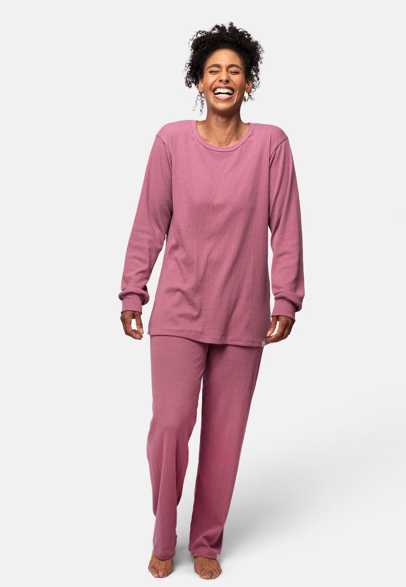 Set di top a maniche lunghe a coste rosa e pantaloni coordinati. Tessuto morbido con vestibilità rilassata; scollo rotondo e maniche lunghe.