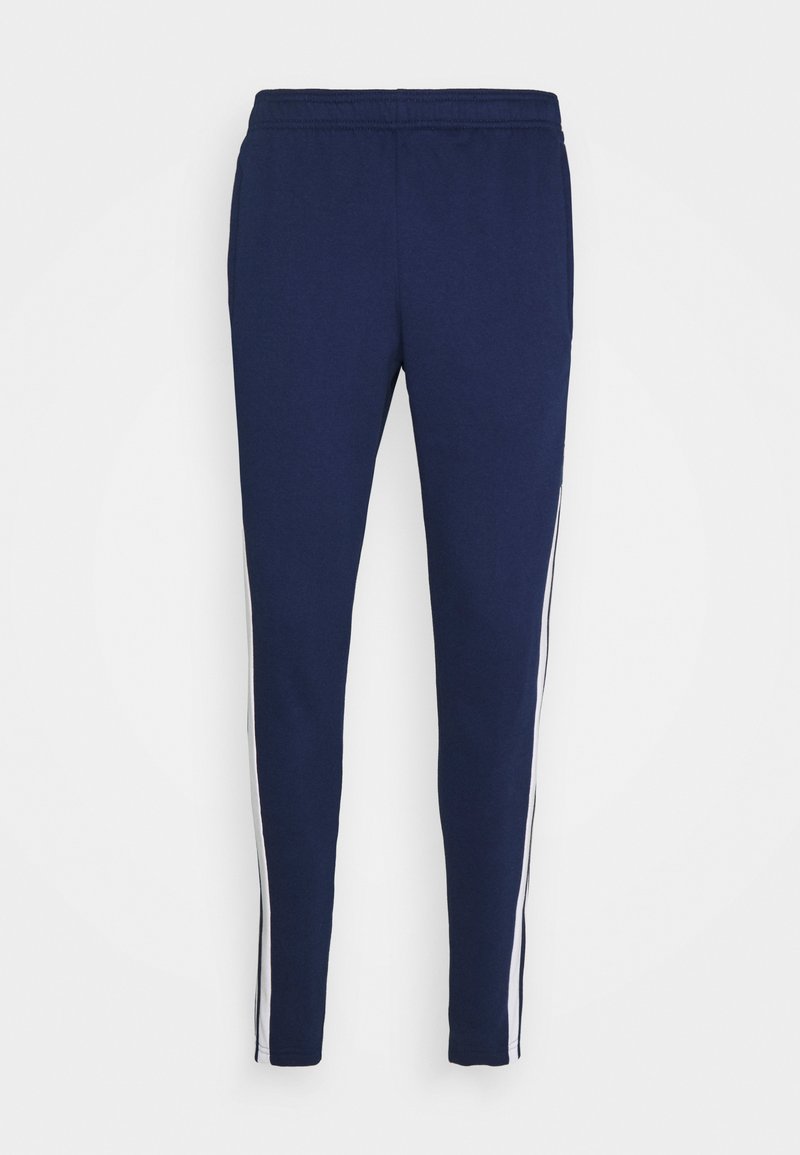 Marineblauwe joggers van zacht materiaal, met een slim fit, elastische tailleband en witte zijstrepen langs de naden.