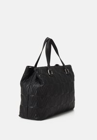 Black quilted tote bag with structured shape, dual top handles, and silver hardware accents. Features a geometric pattern on leather texture.