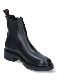 Stivale Chelsea in pelle nera con pannelli laterali elastici, un linguetta sul retro e una suola in gomma spessa. Design elegante con punta rotonda.