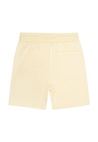 Yellow cotton shorts with a ribbed elastic waistband, a single back pocket, and minimal white logo detailing. Smooth texture and tailored fit.