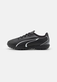 Scarpa sportiva nera con tomaia sintetica, dotata di accenti bianchi e suola in gomma testurizzata per una buona trazione. Design con lacci, profilo basso.