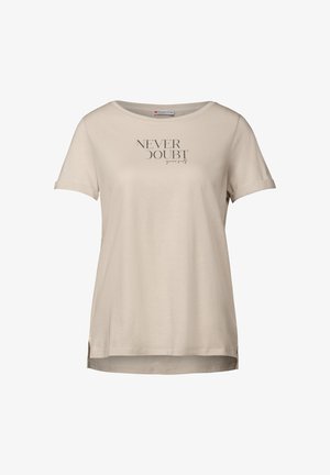 Helles beiges T-Shirt mit kurzen Ärmeln, rundem Ausschnitt und seitlichen Schlitzen. Merkmale den Text "ZWEIFEL NIE an dir selbst" in dunkelgrau. Glatte Stofftextur.