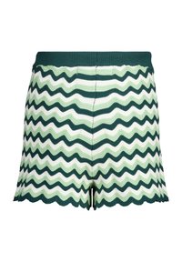 Neulehousut, joissa on sahalaitakuosi tumman vihreänä, vaalean vihreänä ja valkoisena. Laitasomisteettu helma ja ribatusta vyötäröstä. Teksturoitu kangas.