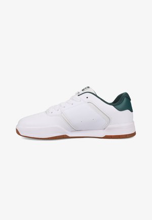 White athletic shoe with a smooth leather upper, green accents on the heel, and a brown rubber sole. Features traditional lace-up design.