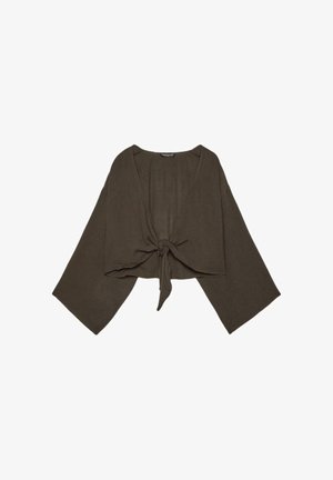 Blouse marron courte avec manches larges et nœud à l'avant, en tissu léger.