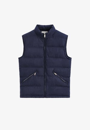 Veste sans manches matelassée bleu marine avec col montant, fermeture éclair frontale et deux poches diagonales zippées.