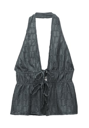 Haut halter gris avec un motif tissé texturé, lien ajustable à la taille et décolleté plongeant. Fabriqué à partir d'un tissu léger.