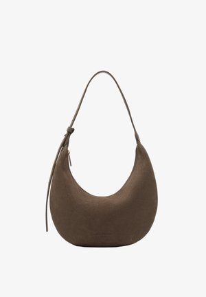 Brown suede crescent-shaped handbag with a single shoulder strap and zipper pull detail on a white background.
