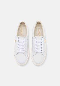 Pair of white leather sneakers with white laces and beige insoles branded "Lauren Ralph Lauren," viewed from above on a white background.