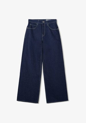 Weite, dunkle Jeans mit klassischem Fünf-Taschen-Design. Merkmale sind kontrastierende weiße Nähte und ein hoch geschnittener Bund.