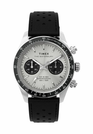 Silver chronograph watch with a black tachymeter bezel, two black sub-dials, and a black perforated leather strap. Text includes "TIMEX THE WATERBURY."