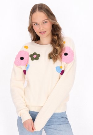 Crème trui met kleurrijke bloemen borduursels in roze, groen, blauw en paars. Heeft een ronde halslijn en geribbelde manchetten en zoom.