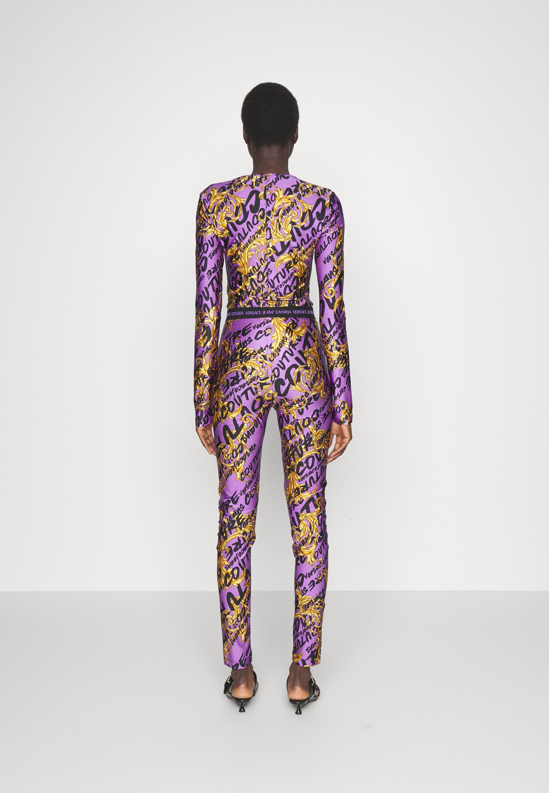 Versace Jeans Couture SHINY SUMATRA - Leggings - Trousers -  gold/iris/gold-coloured - Zalando.co.uk