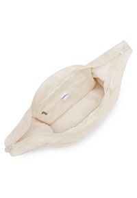 Cream-colored bag with smooth fabric, dual zippers, and a small internal pocket. Interior is lined and spacious, with a labeled tag.