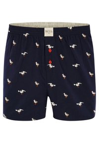Boxer in navy con motivo di gabbiani bianchi sparsi, con bottoni rossi e fascia elastica in vita; texture morbida del tessuto.
