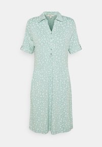 Vestito button-up verde chiaro con motivo a foglie bianche, maniche corte arrotolate e colletto. Tessuto fluido con una silhouette a taglio rilassato.