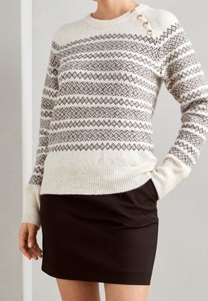 Stickad tröja - beige