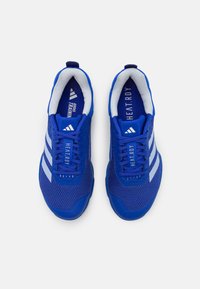 Blue athletic shoes with mesh upper, contrasting white stripes, padded collar, and textured sole. Features "HEAT.RDY" branding inside.