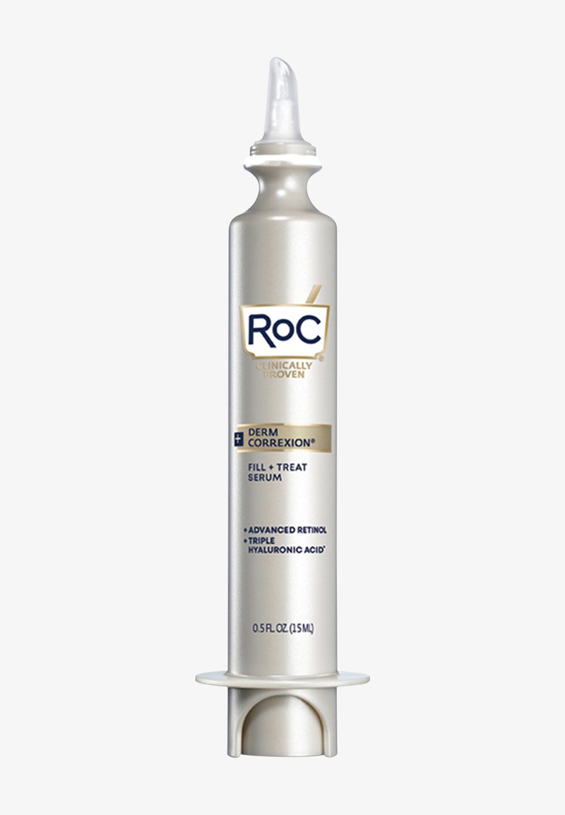 Tube de sérum argenté avec un applicateur effilé, étiqueté "RoC Derm Correxion Remplir + Traiter Sérum", mettant en avant le rétinol avancé et l'acide hyaluronique.
