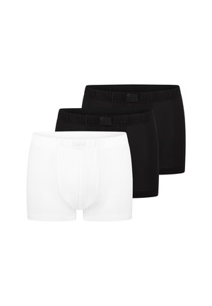 Trzy męskie bokserki w białym i czarnym kolorze, ułożone w rzędzie, z białą parą z przodu i dwoma czarnymi parami z tyłu.