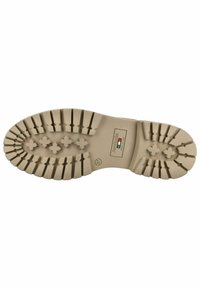 Suola in gomma beige con battistrada profondo, caratterizzata da motivi orizzontali e verticali. Contrassegnata con "Made in Italy" e taglia 37.