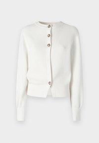 Gilet en tricot blanc avec un col rond, des manches longues et quatre boutons marron sur le devant. Design court avec des poignets côtelés.