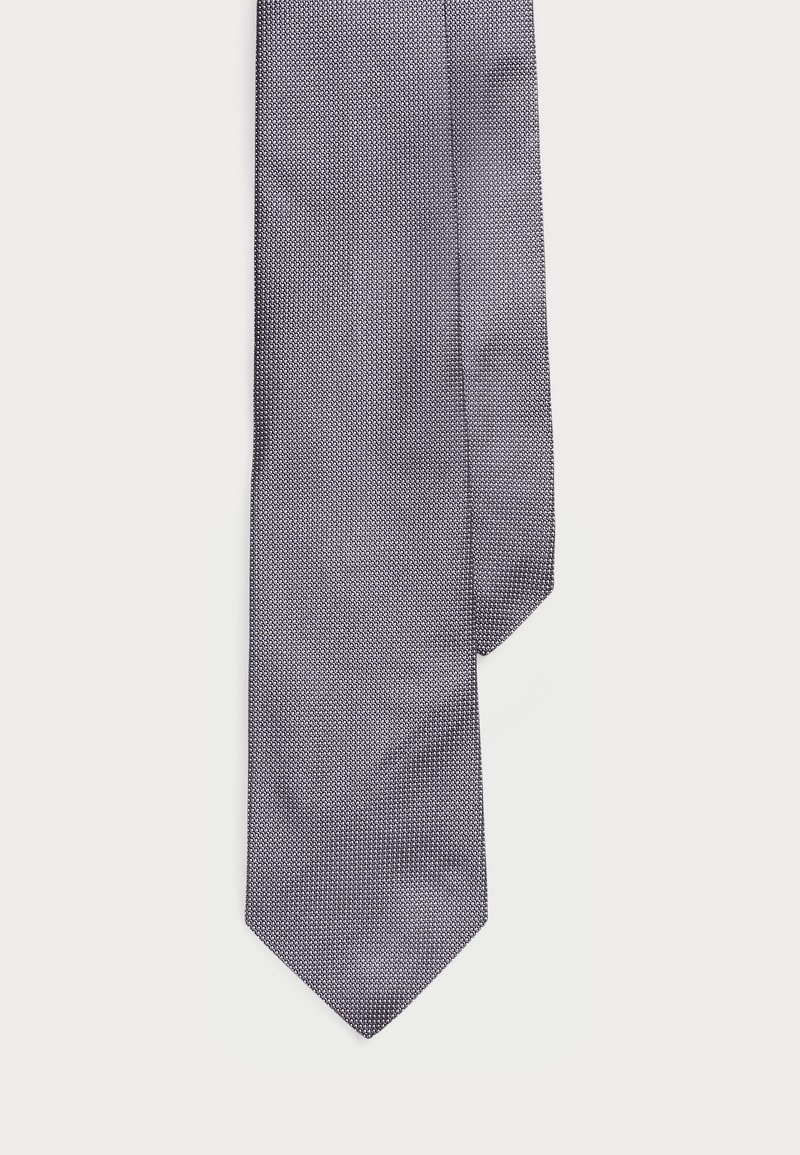 Σκούρο μπλε γραβάτα με υφή, με στενή διάσταση και αιχμηρή άκρη. Κατασκευασμένη από λείο ύφασμα, κατάλληλη για επίσημες περιστάσεις.