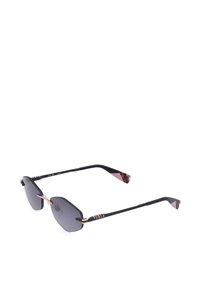 Lunettes de soleil noires sans monture avec verres foncés, branches fines noires, pont nasal en or rose et marquage Furla sur le côté.