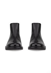Paire de bottines en cuir noir avec bouts arrondis et semelles plates, vues de face sur fond blanc.