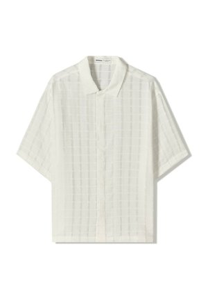Chemise blanche à manches courtes avec un motif à carreaux texturé, boutonnière à l'avant, tissu doux et col classique.