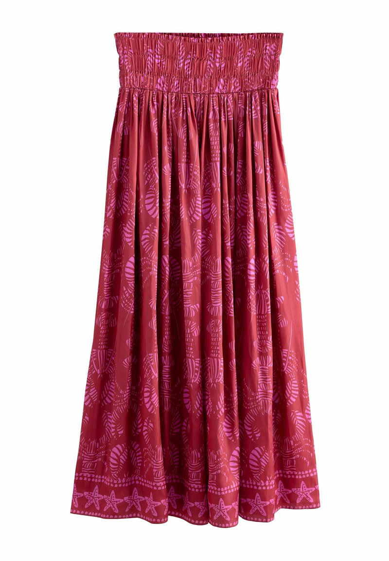 Jupe rouge avec taille smockée, ornée d'un motif botanique rose. Elle a un design fluide et un ourlet festonné avec des motifs d'étoiles de mer.