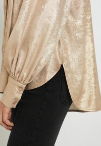 Next Blúz - rose gold