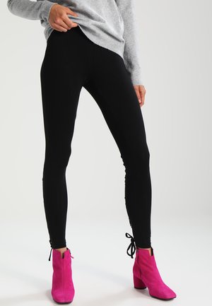 LACED UP BACK - Leggings - Trousers - black