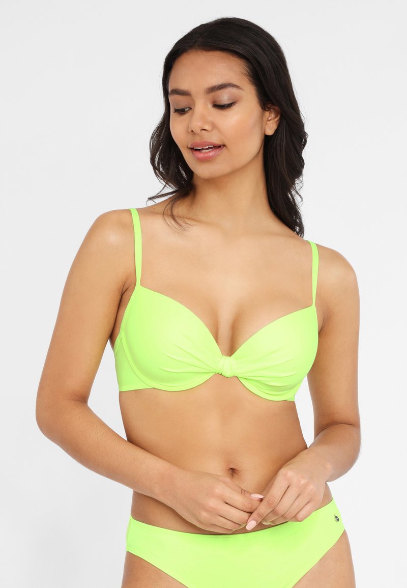 Neon grünes Bikini-Set mit einem geknoteten Frontdetail. Das Oberteil hat verstellbare dünne Träger und eine glatte, dehnbare Textur.