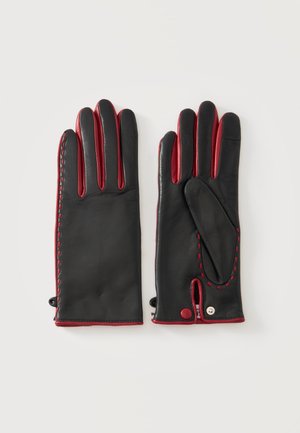 Coppia di guanti in pelle nera con rifinitura rossa, cuciture e chiusura a scatto, mostrati distesi con palmo e dorso visibili.