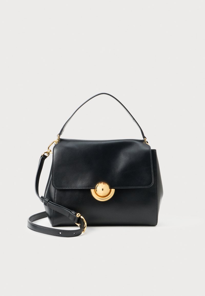 Black structured leather handbag with a top handle, adjustable shoulder strap, and gold circular clasp on front flap.