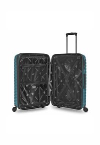 Valigia rigida di colore teal, interno nero con motivo a logo, duplice scomparto con tasche in rete zippate e cinghie regolabili, manico retrattile, ruote.