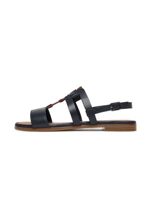 Navy blue leather sandal with open toe, featuring multiple straps and adjustable ankle buckle, resting on a brown flat sole.
