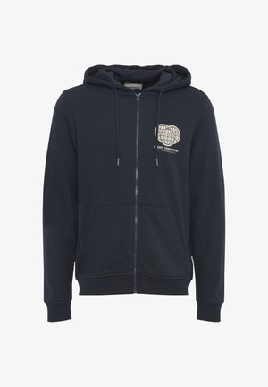 Tumed zip-up kapuutsiga pulli on valmistatud pehmest kangast. Omab esipinda graafikuga, kahte külgtaskut ja nööriga kapuutsi. Ribitud varrukad ja allserv.